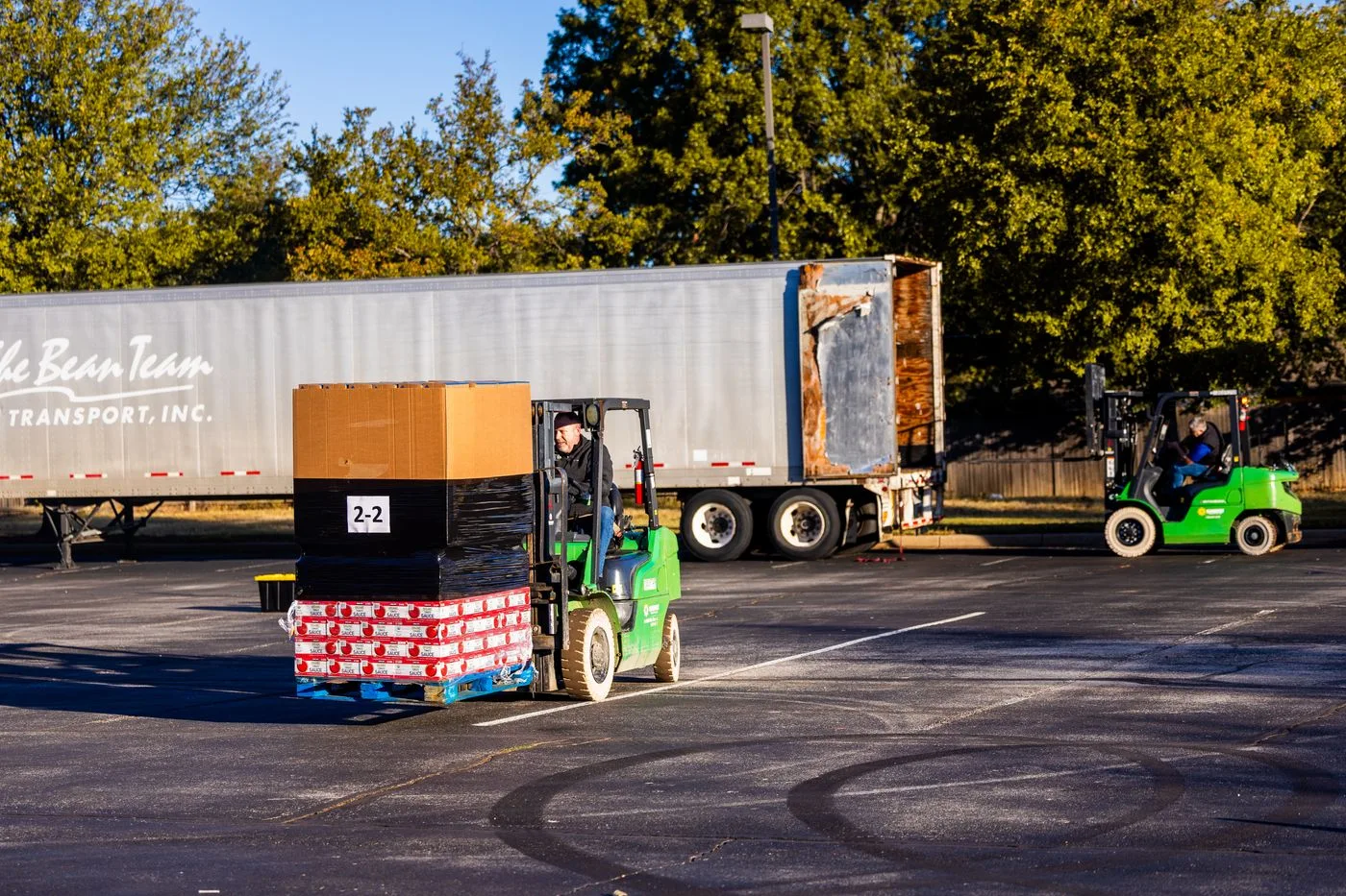 Pallet handling during a delivery operation, shown as illustrative stock photography